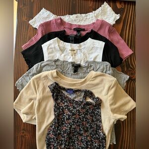 7 small/medium ‘baby’ tees.